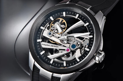PAGANI DESIGN -miestenkello – Mekaaninen automaattinen luksusmalli, ”skelettityyppinen” (avoin rakenne), varustettu tourbillon-mekanismilla, heijastamattomalla safiirilasilla, vesitiivis ja valoa heijastava.